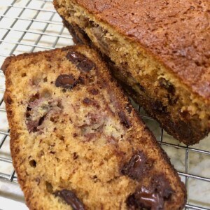 banana bread with chocolate chips on a cooling rack