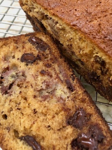 banana bread with chocolate chips on a cooling rack