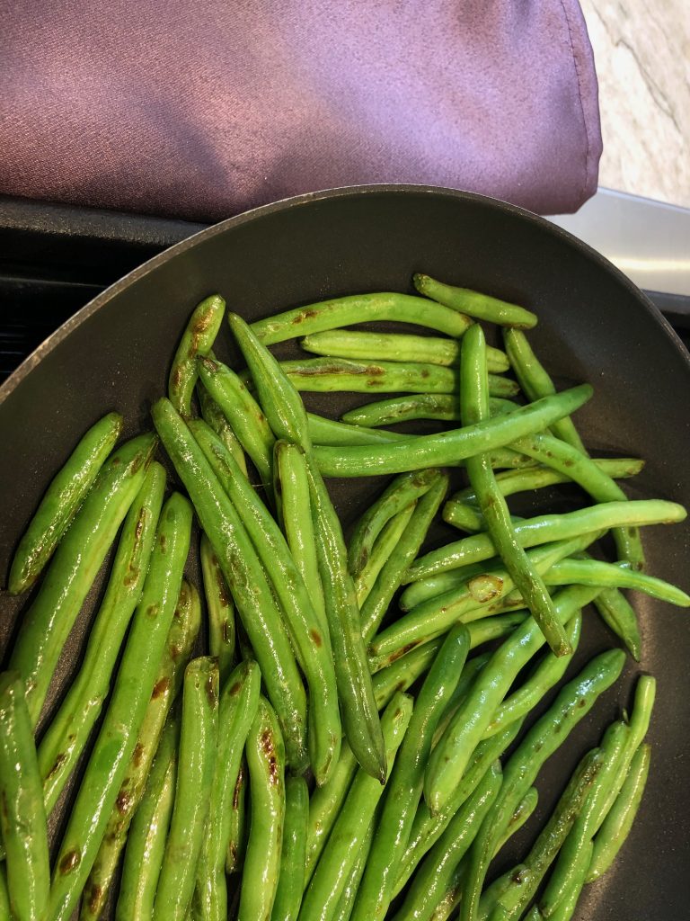 green beans in a pan on the stovetop