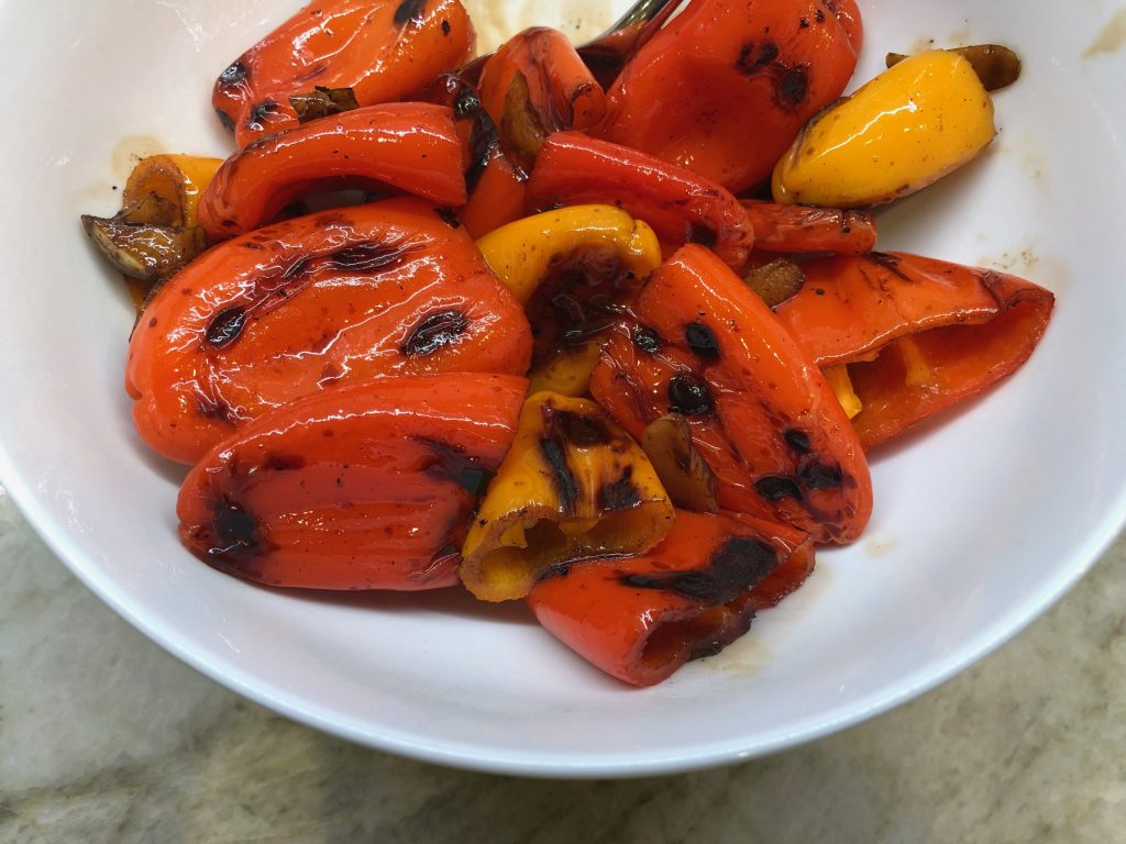 sweet peppers with a balsamic glaze in a white bowl