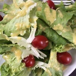The best italian salad dressing on romaine lettuce with tomatoes.