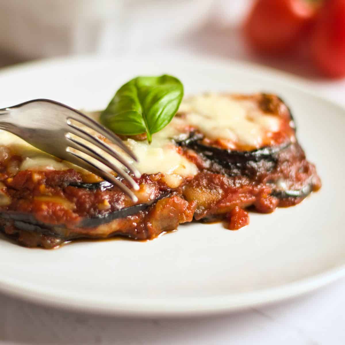 Baked Eggplant Parmesan Without Breadcrumbs Recipe on a white plate.