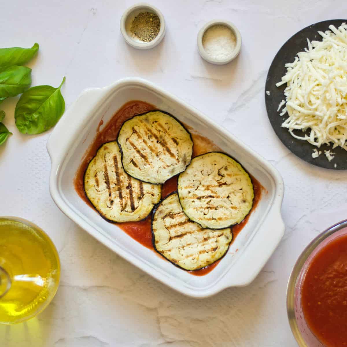 Baked Eggplant Parmesan Without Breadcrumbs Recipe eggplant slices in a casserole pan