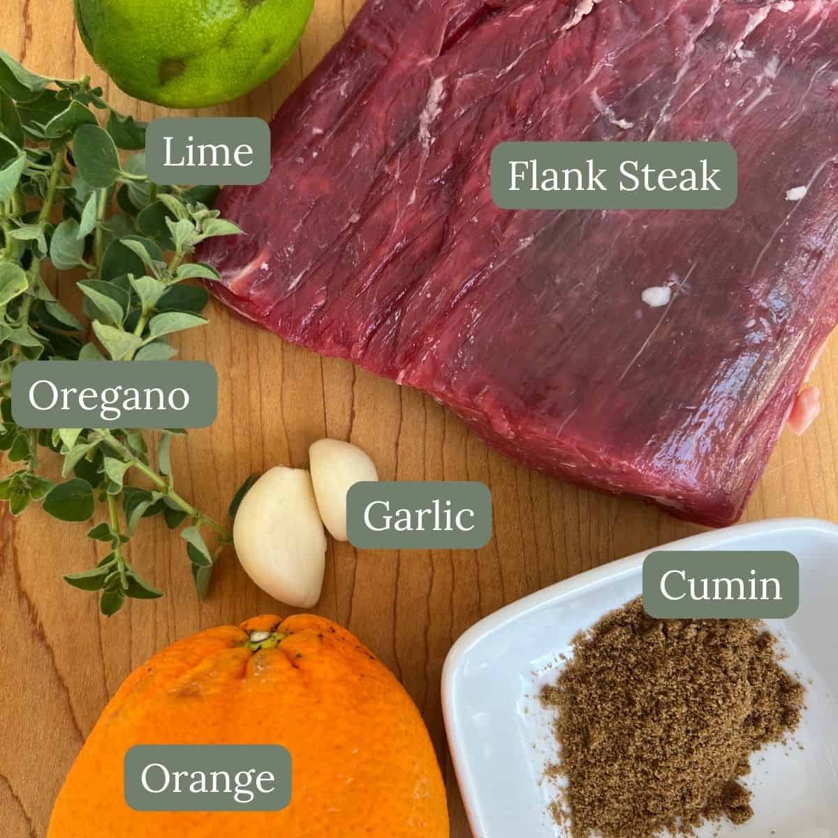 ingredients for grilled cuban flank steak are flank steak, lime, organo, garlic, cumin, and orange. 