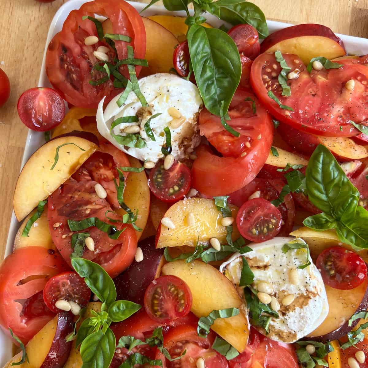 Tomato, Nectarine & Mozzarella Salad Recipe on a plate.