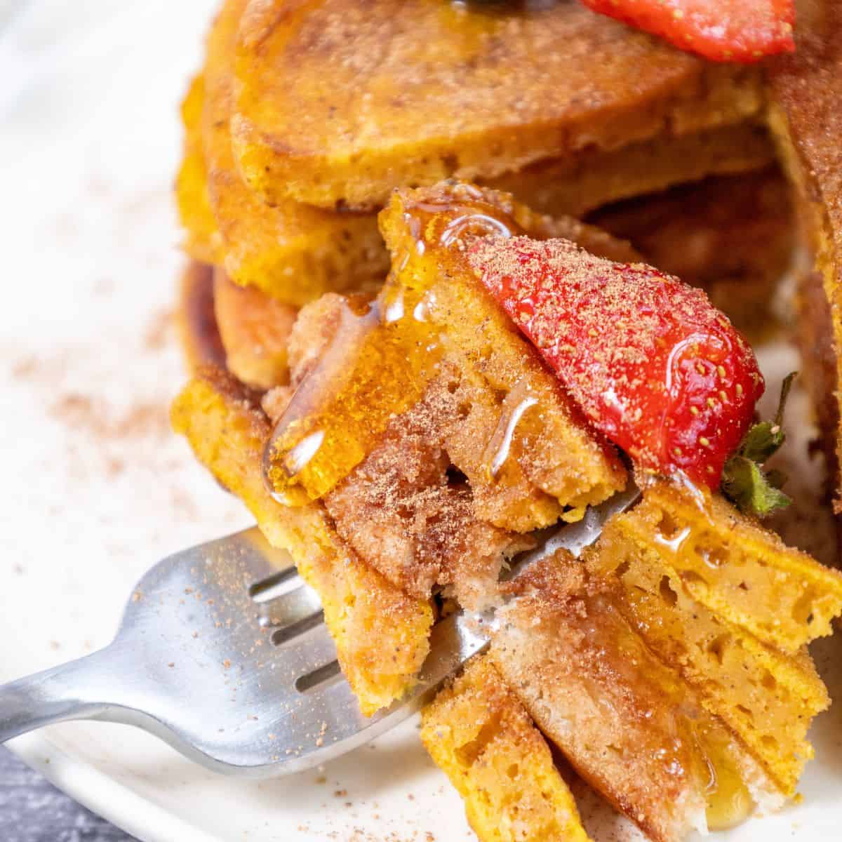 Easy Homemade Gluten-Free Pumpkin Pancakes Recipe on a fork. 