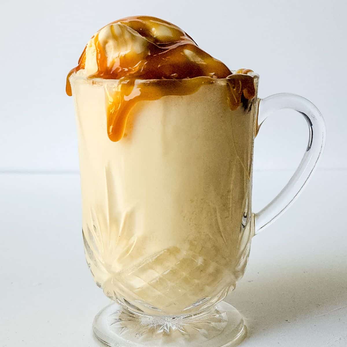 ice cream in a mug with caramel on top