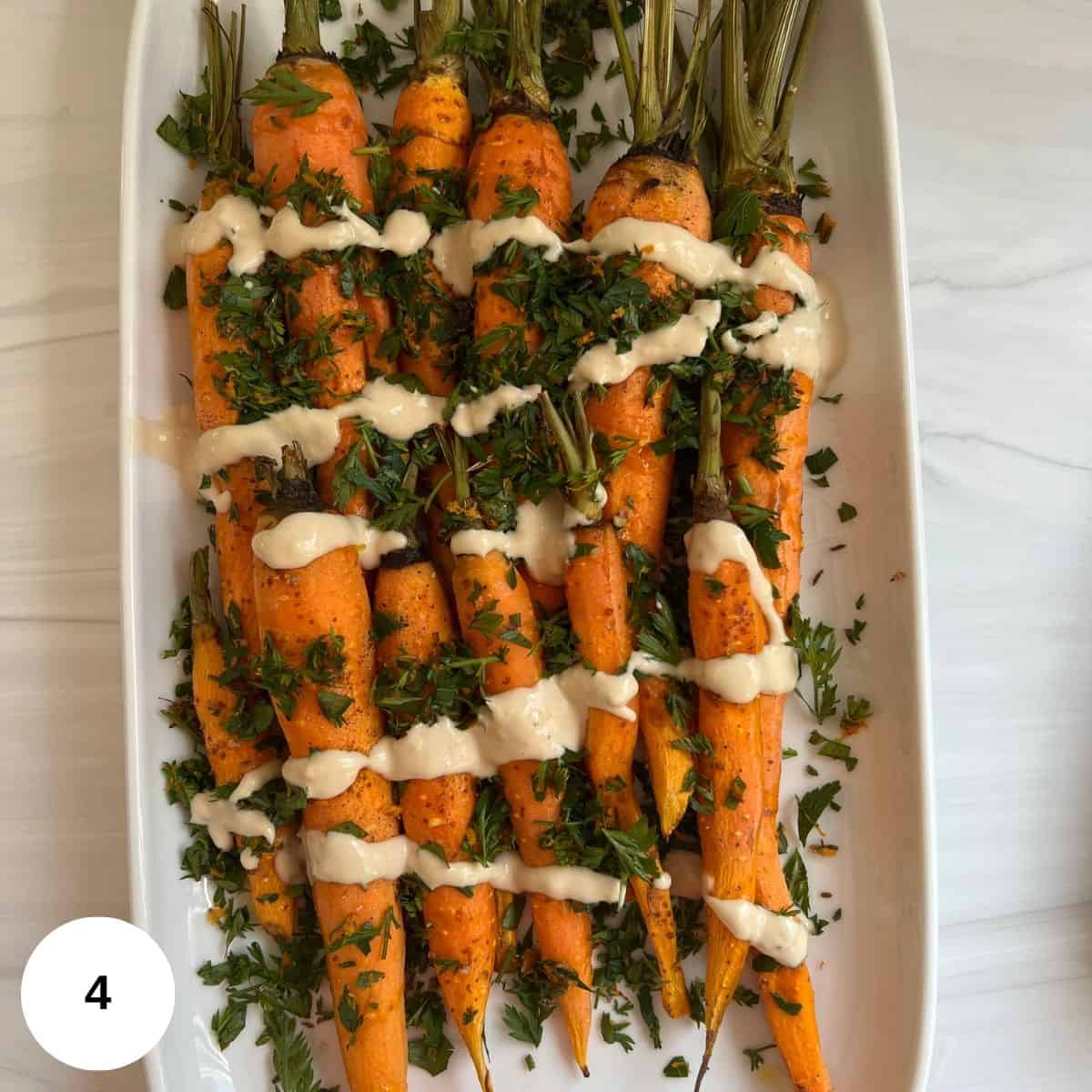 roasted carrots topped with tahini sauce and gremolata.