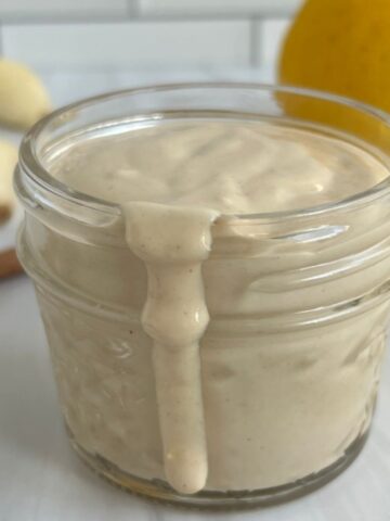 Lemon Garlic Tahini Sauce in a jar. Featured Image