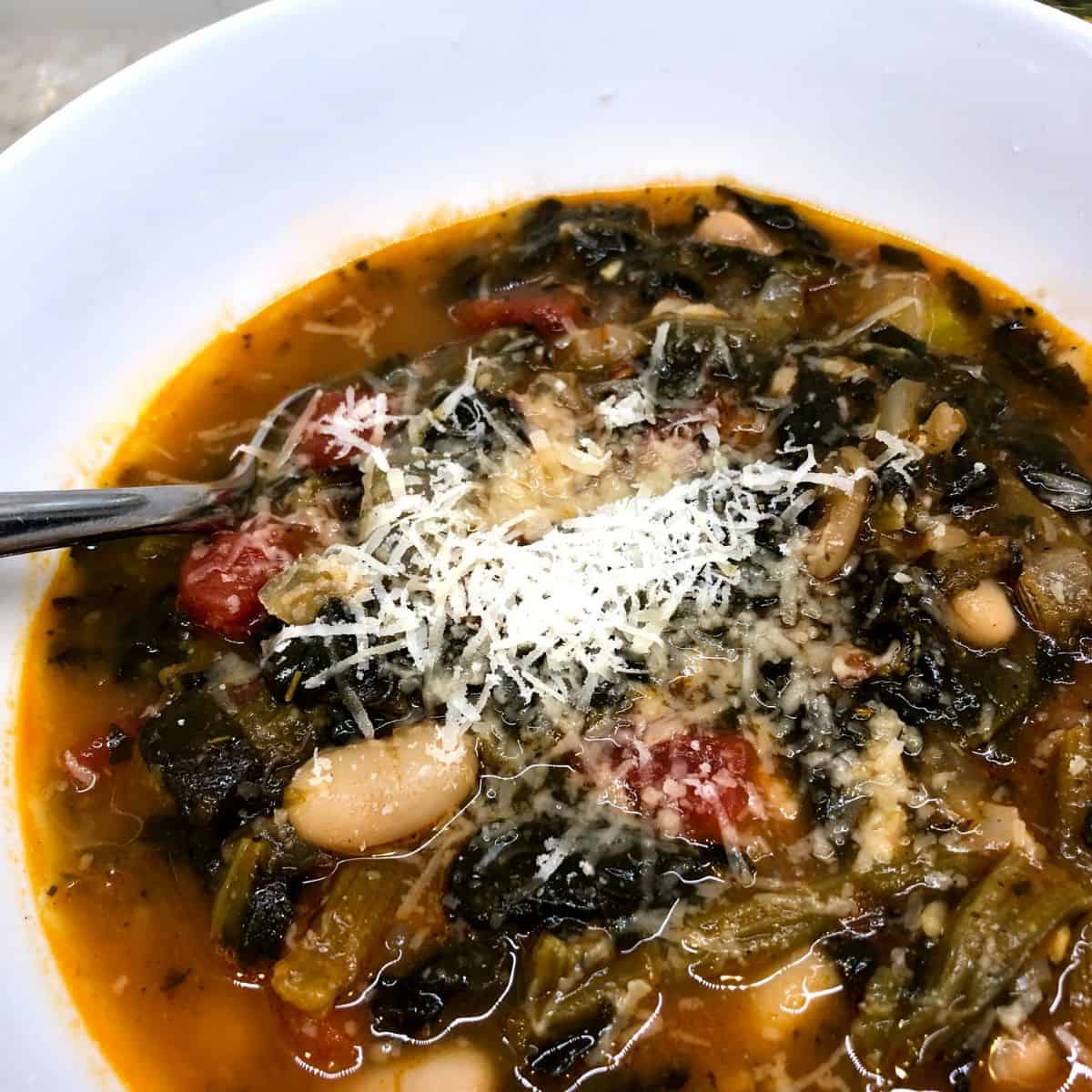 classic italian ribollita soup in a white bowl.