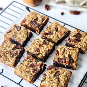 Easy Chocolate Chunk Pecan Cookie Brownie Bar Recipe baked and cooling on a wire rack.