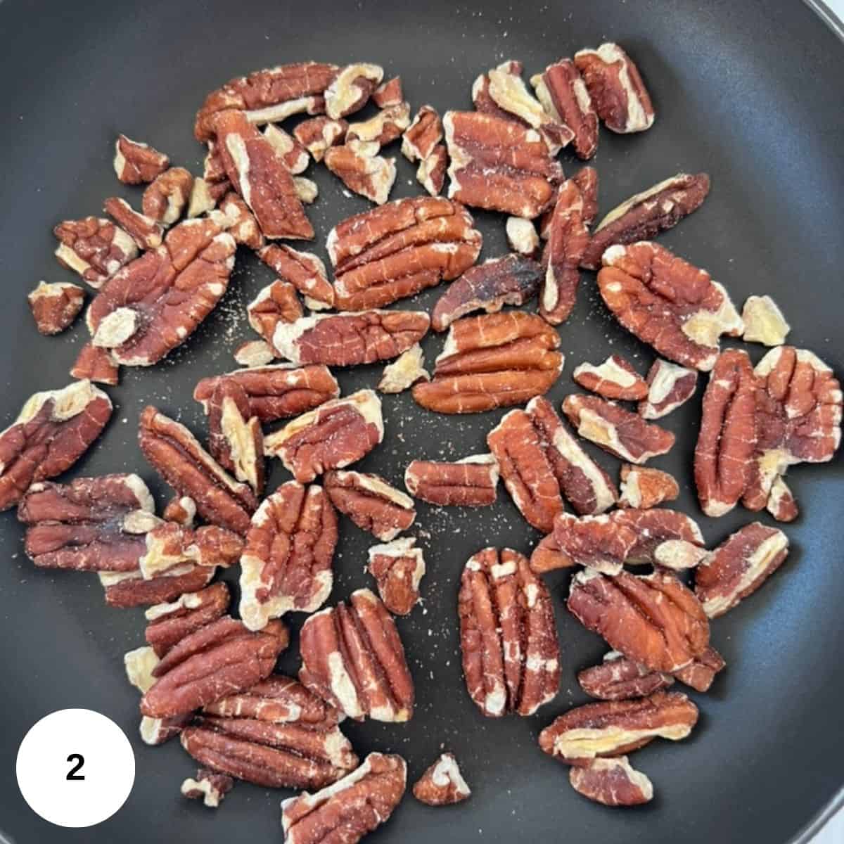 pecans in a pan toasting.