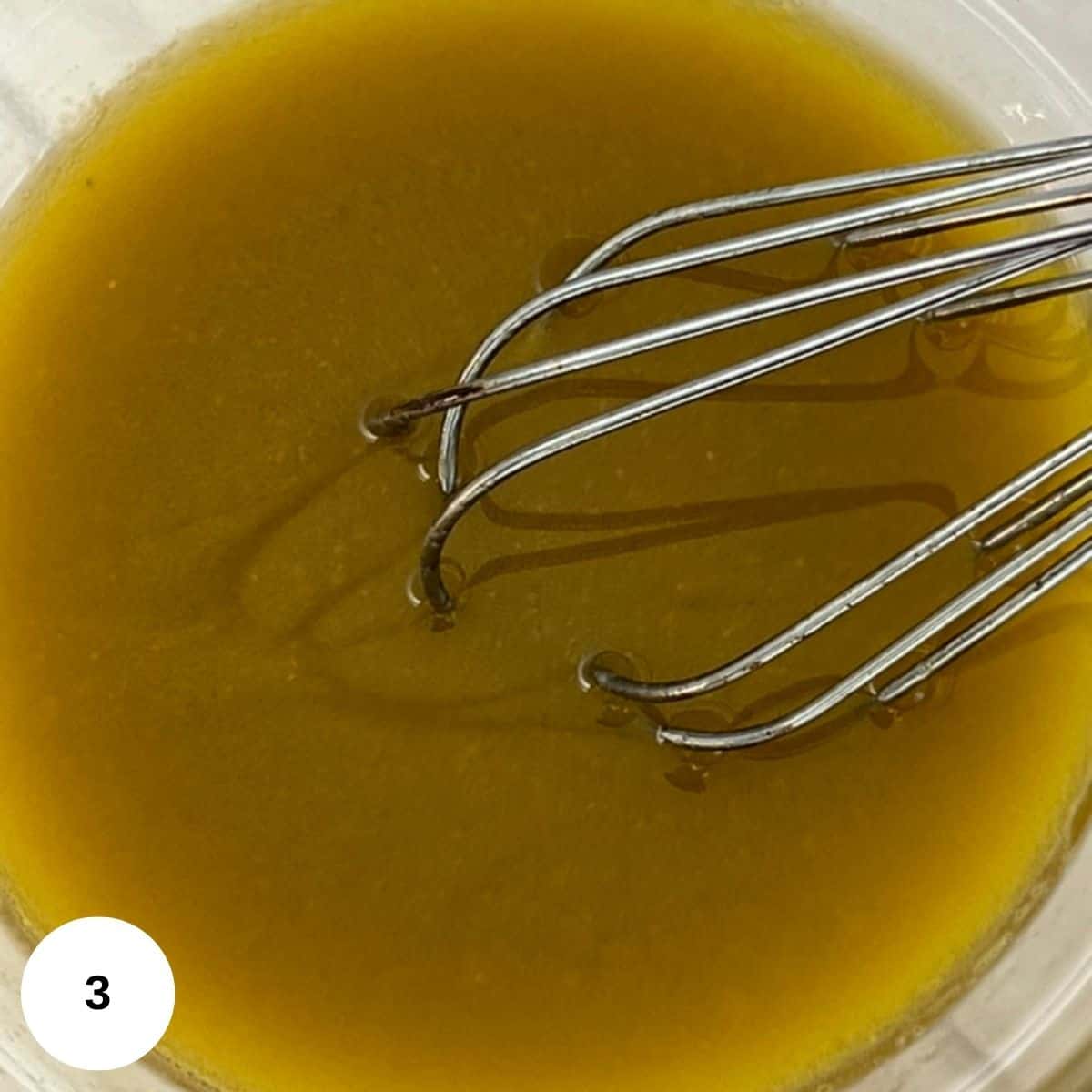 whisking the vinaigrette