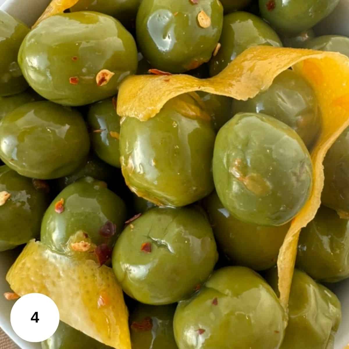 fully cooked olives with lemon peel. 