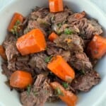 gluten free pot roast and carrots in a white bowl