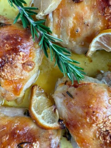 Chicken thighs baked with lemon and rosemary.