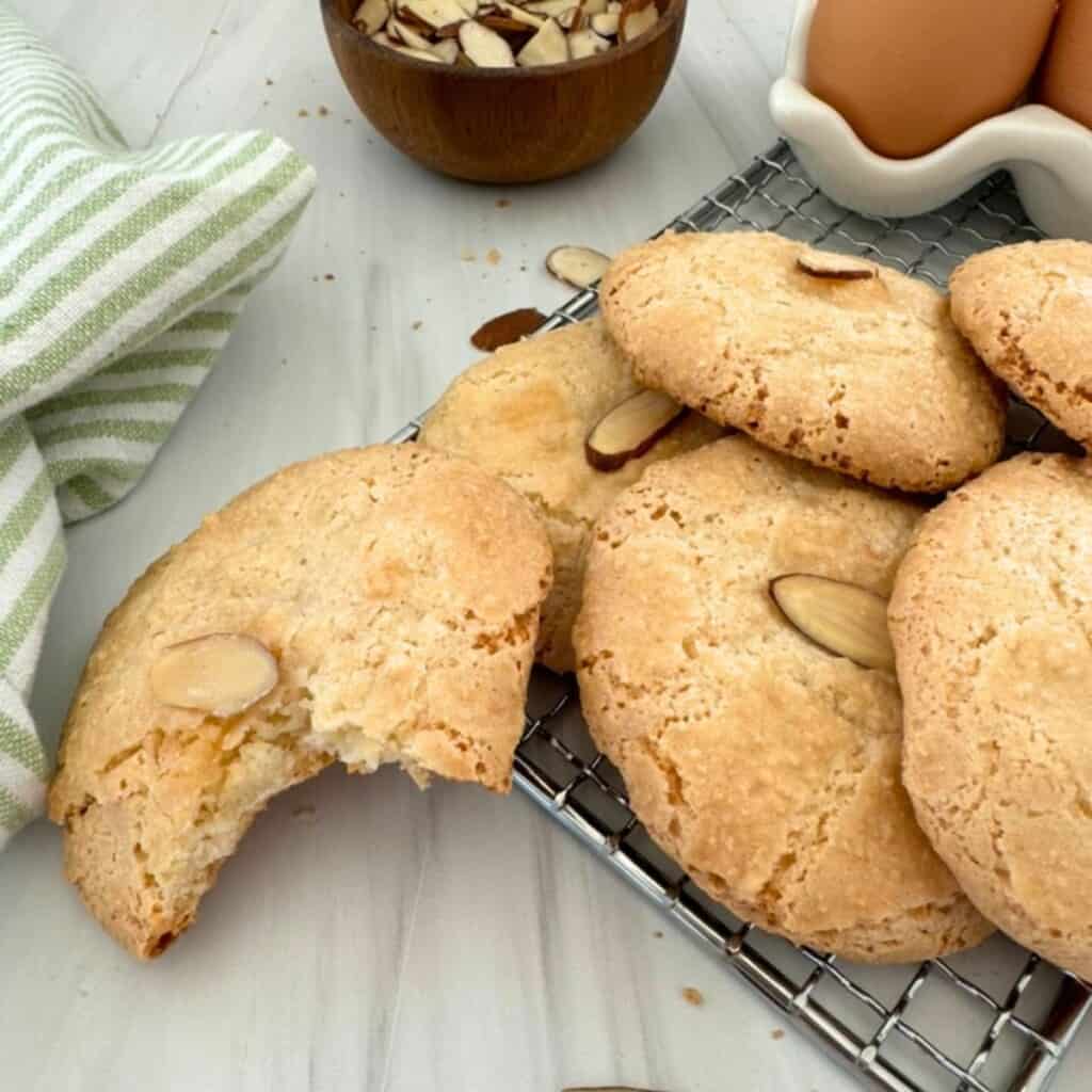 Almond macaroon cookies on a wire rack.