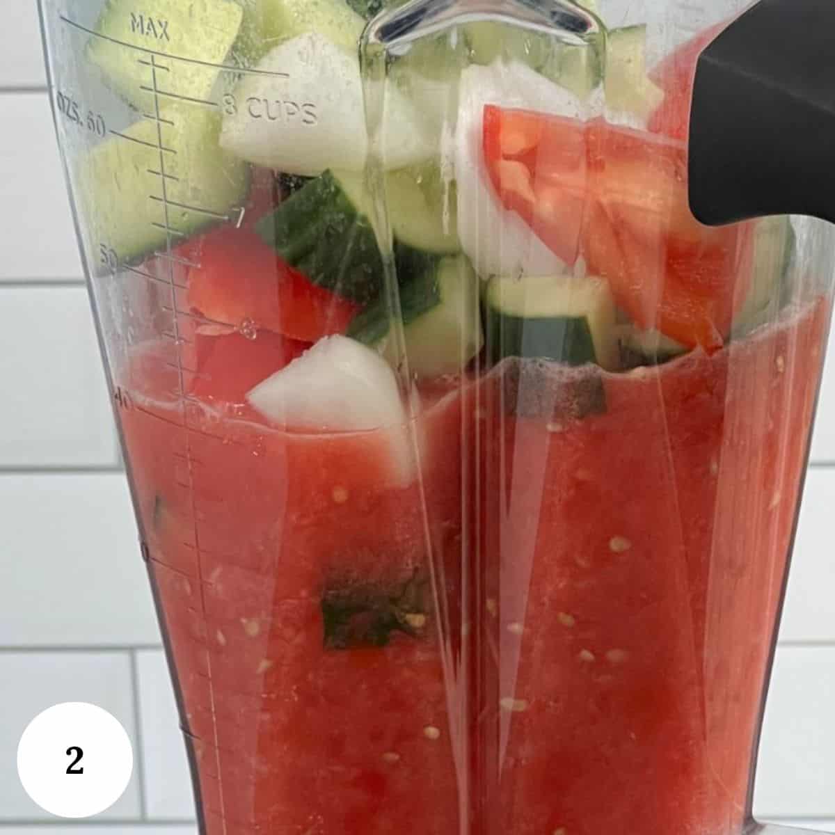 Adding the ingredients to a blender. 