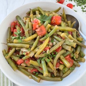 Greek Green Beans Recipe in a white bowl.