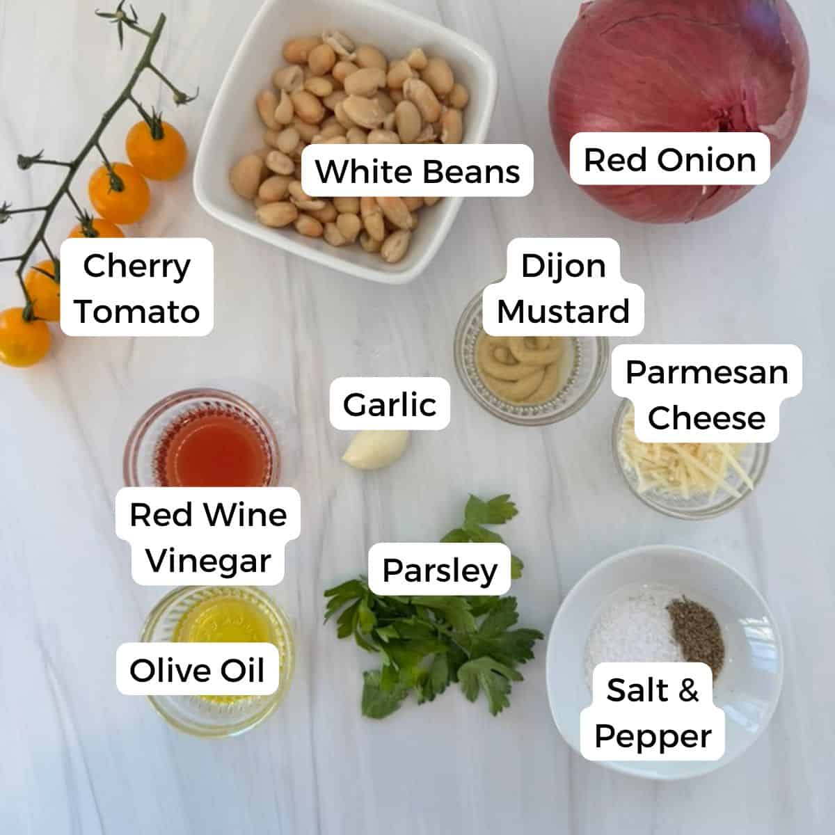 Ingredients include white beans, red onion, cherry tomato, dijon mustard, garlic, parmesan cheese, salt, pepper, parsley, red wine vinegar, and olive oil. 