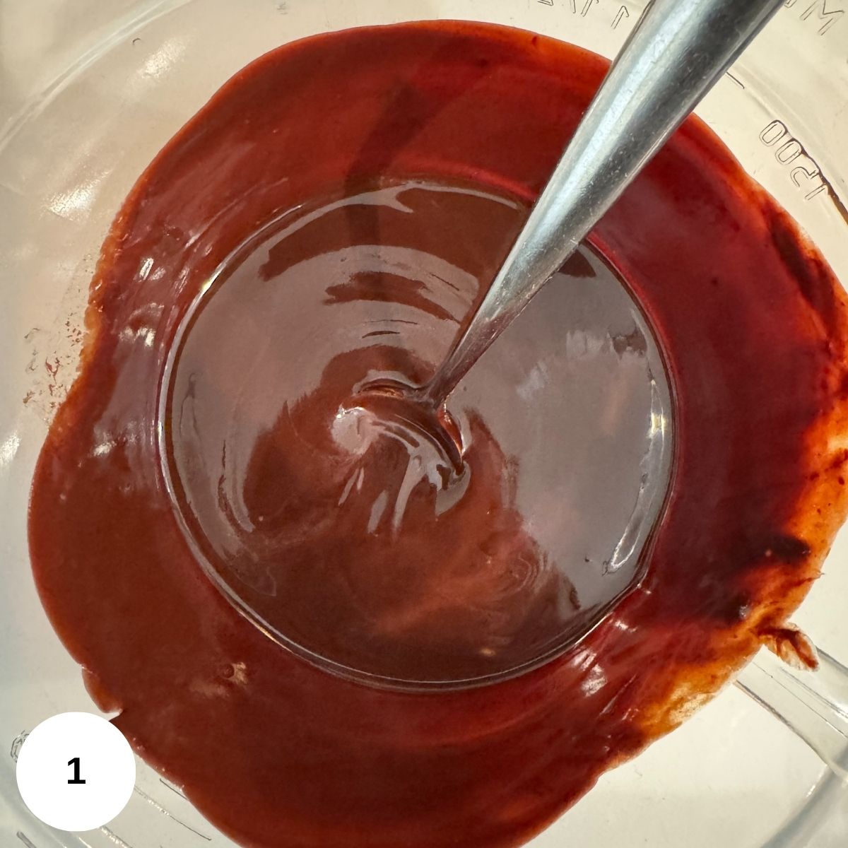 Melted chocolate in a glass bowl. 