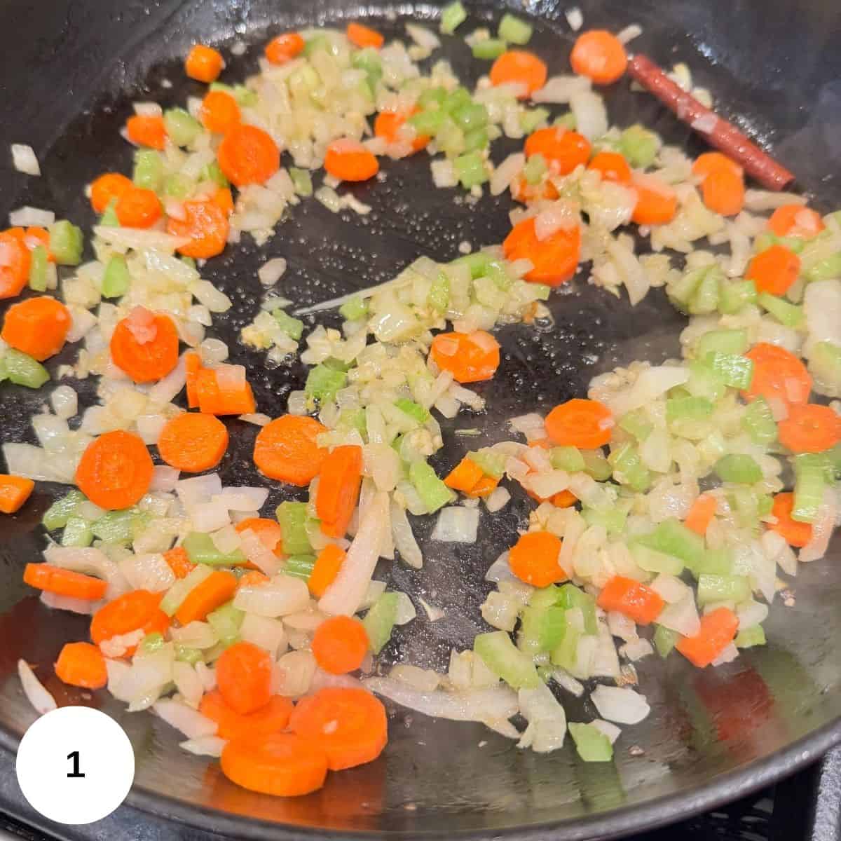 Sauteeing onions, celery, carrots, and garlic. 