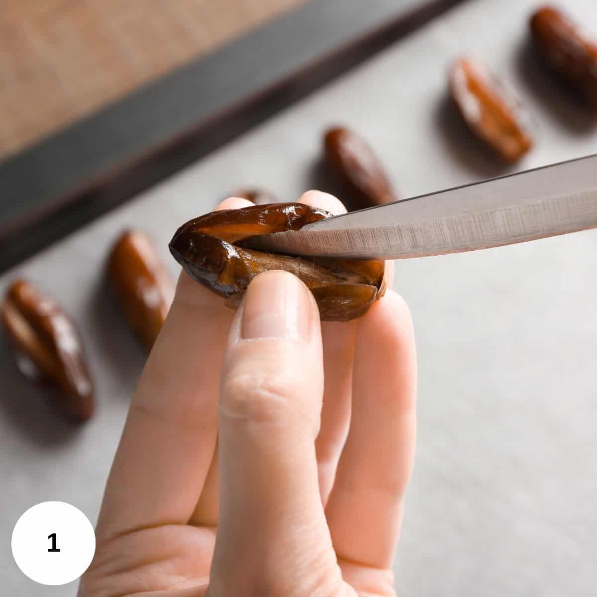 Slicing open a date and removing the pit. 