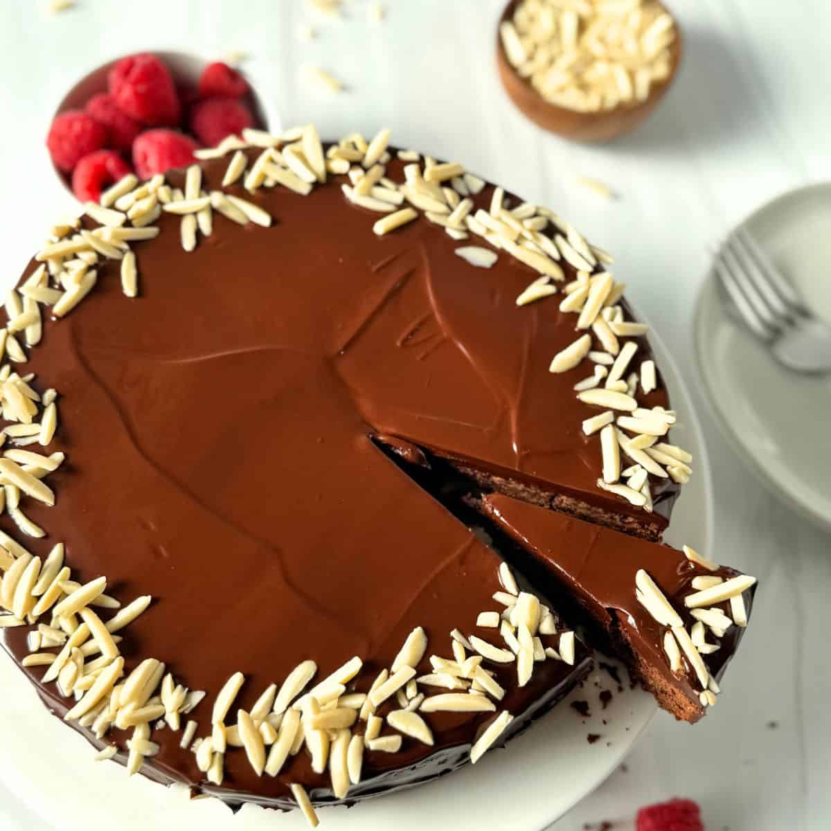 Showing a slice of the torte being removed from the cake. 