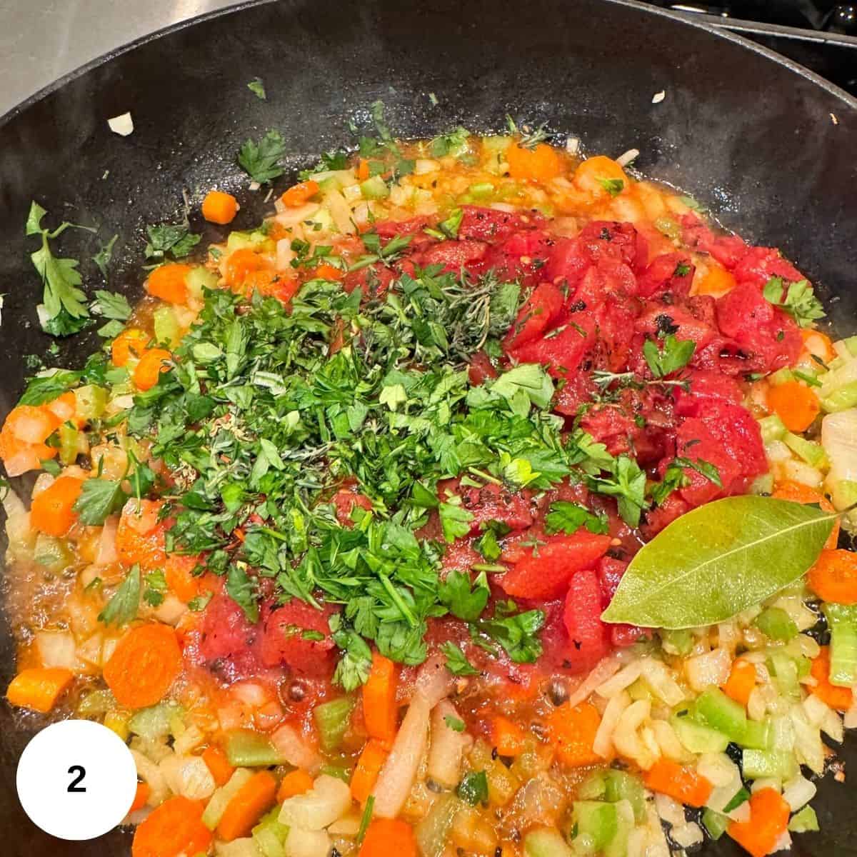 Adding tomatoes and all of the spices. 