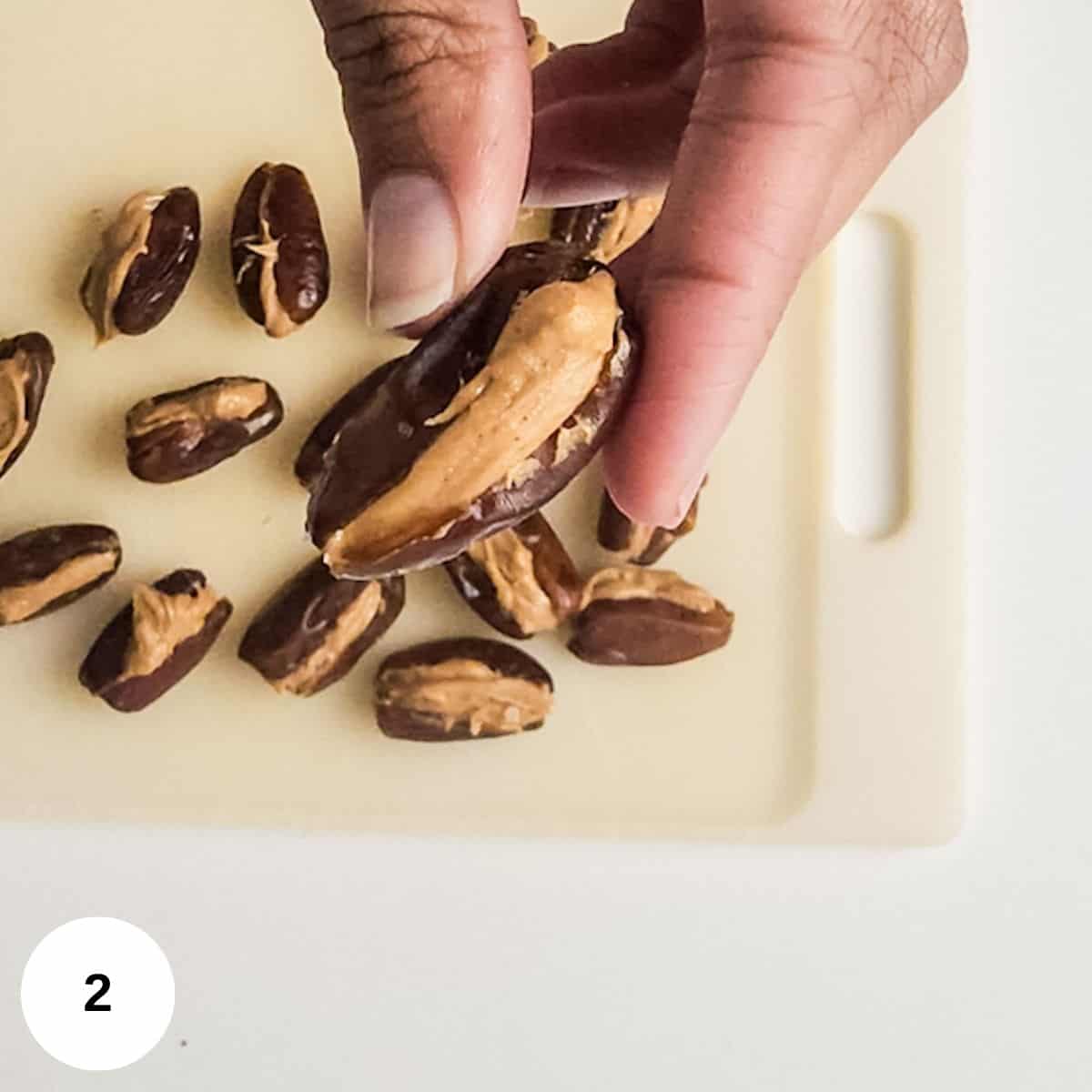 Stuffing the dates with peanut butter. 