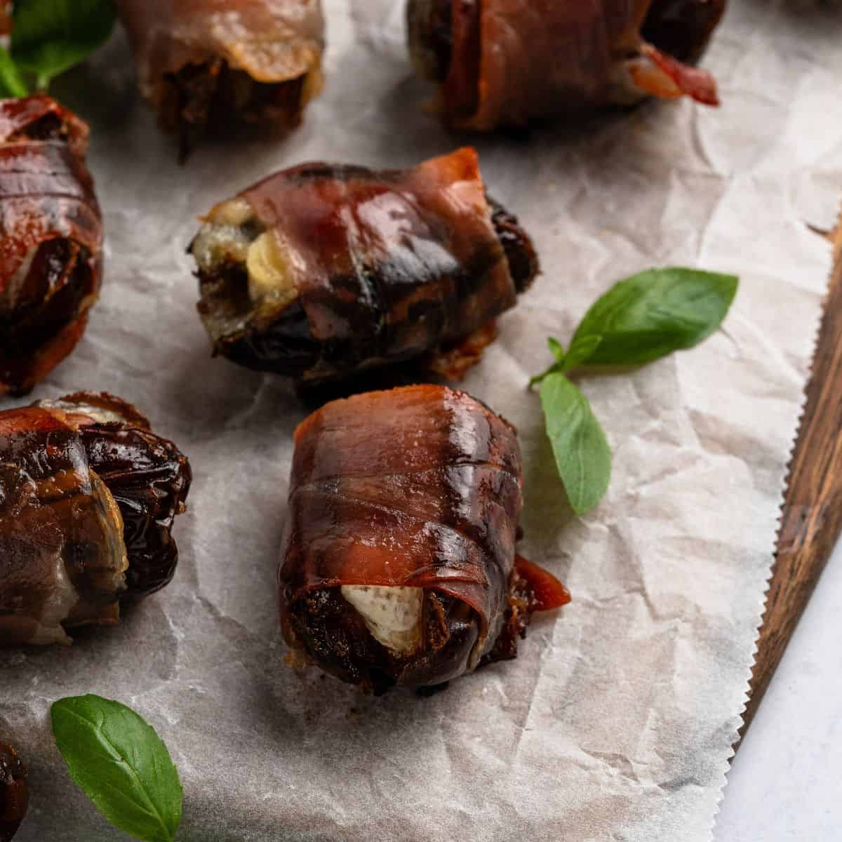 Dates sitting on parchment paper. 