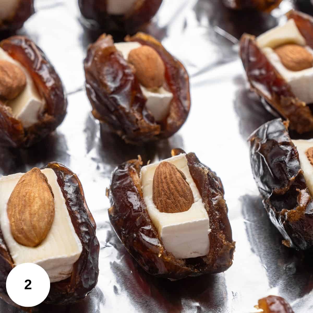 Putting the goat cheese and almond in the date. 