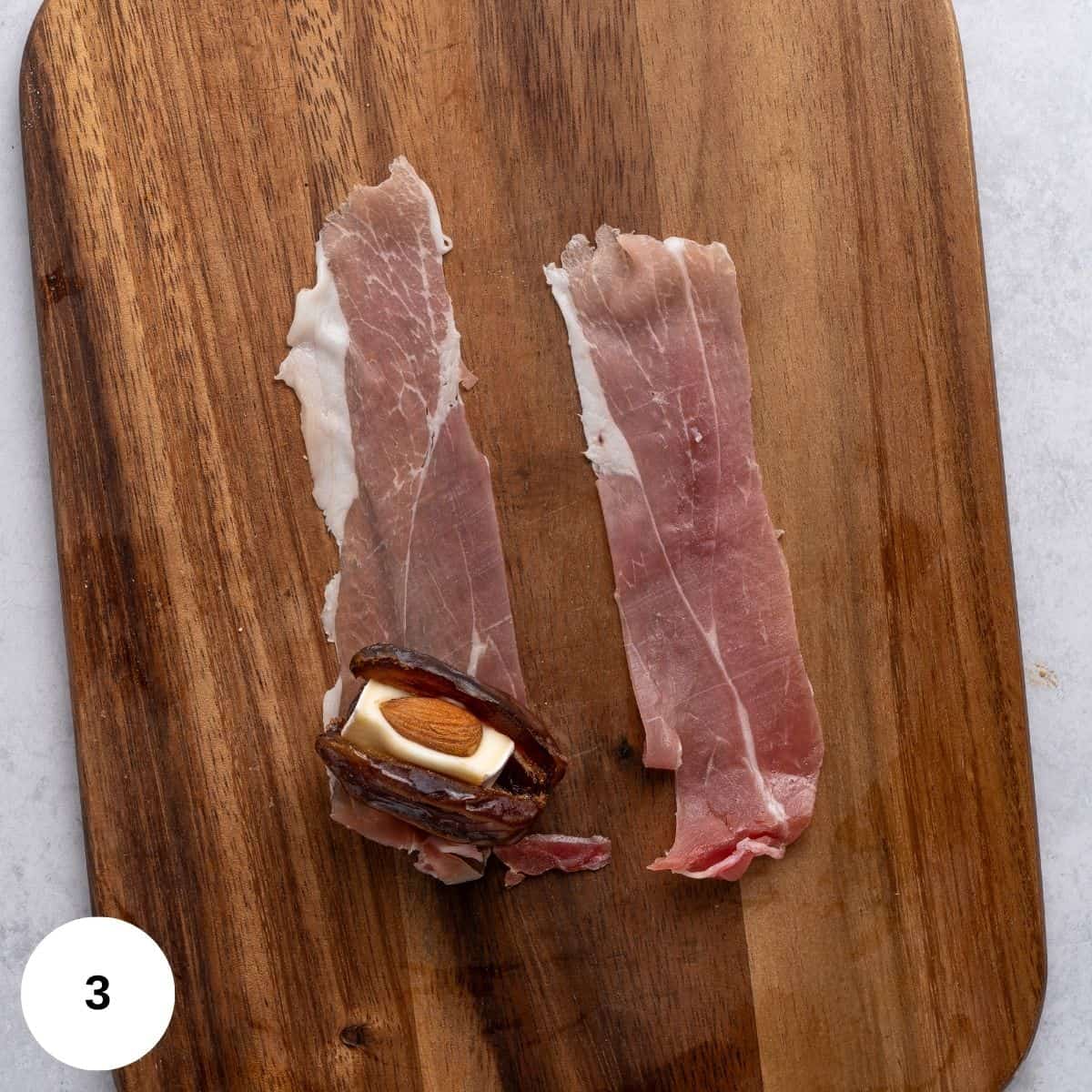Wrapping the date with proscuitto. 