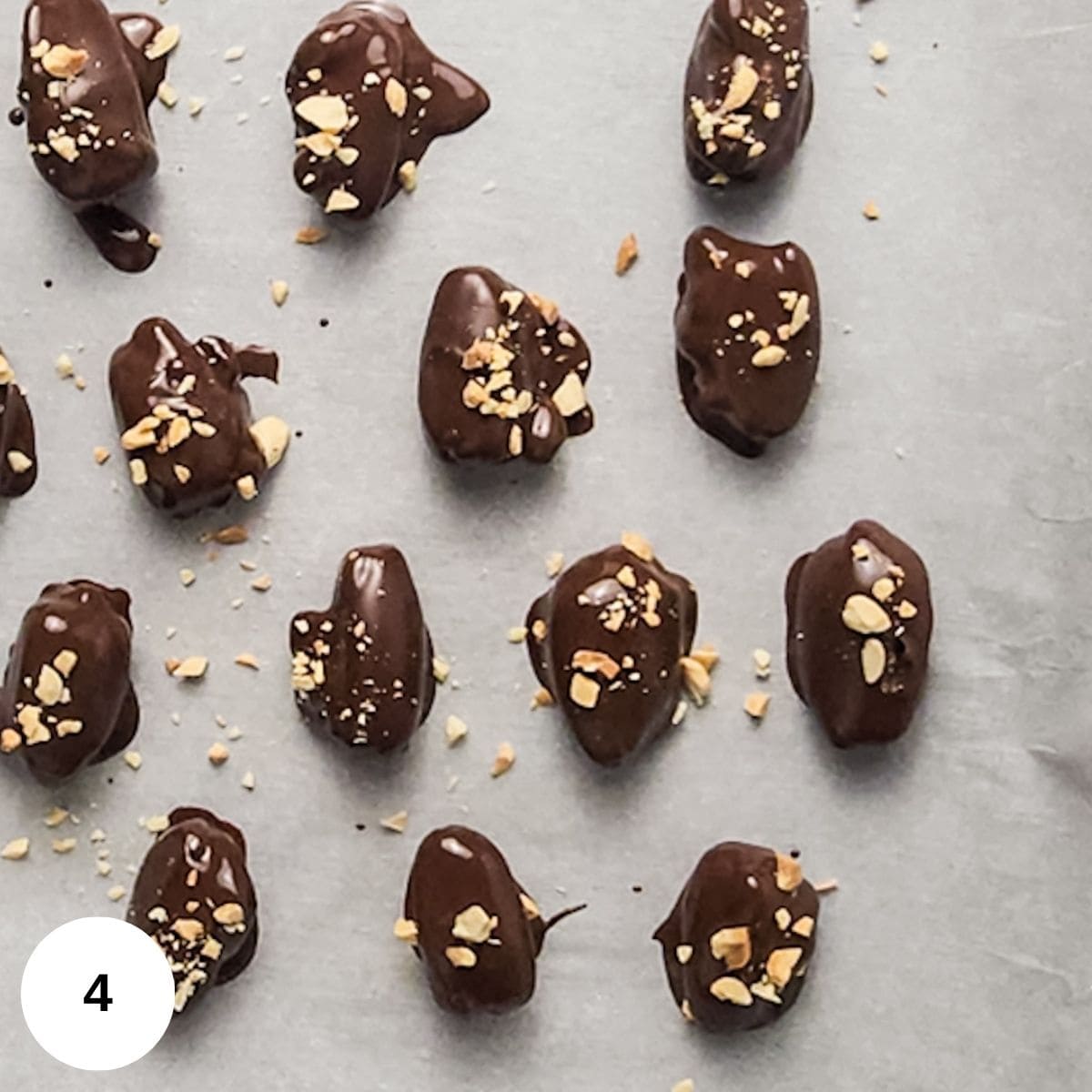 Covered the dates in chocolate and topped with nuts. 