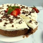 Chocolate Mousse Cheesecake with one slice starting to come out of the cake.