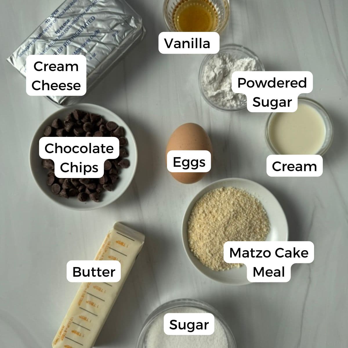 Ingredients include cream cheese, canilla, powdered sugar, cream eggs, chocolate chips, butter, and matzo cake meal.