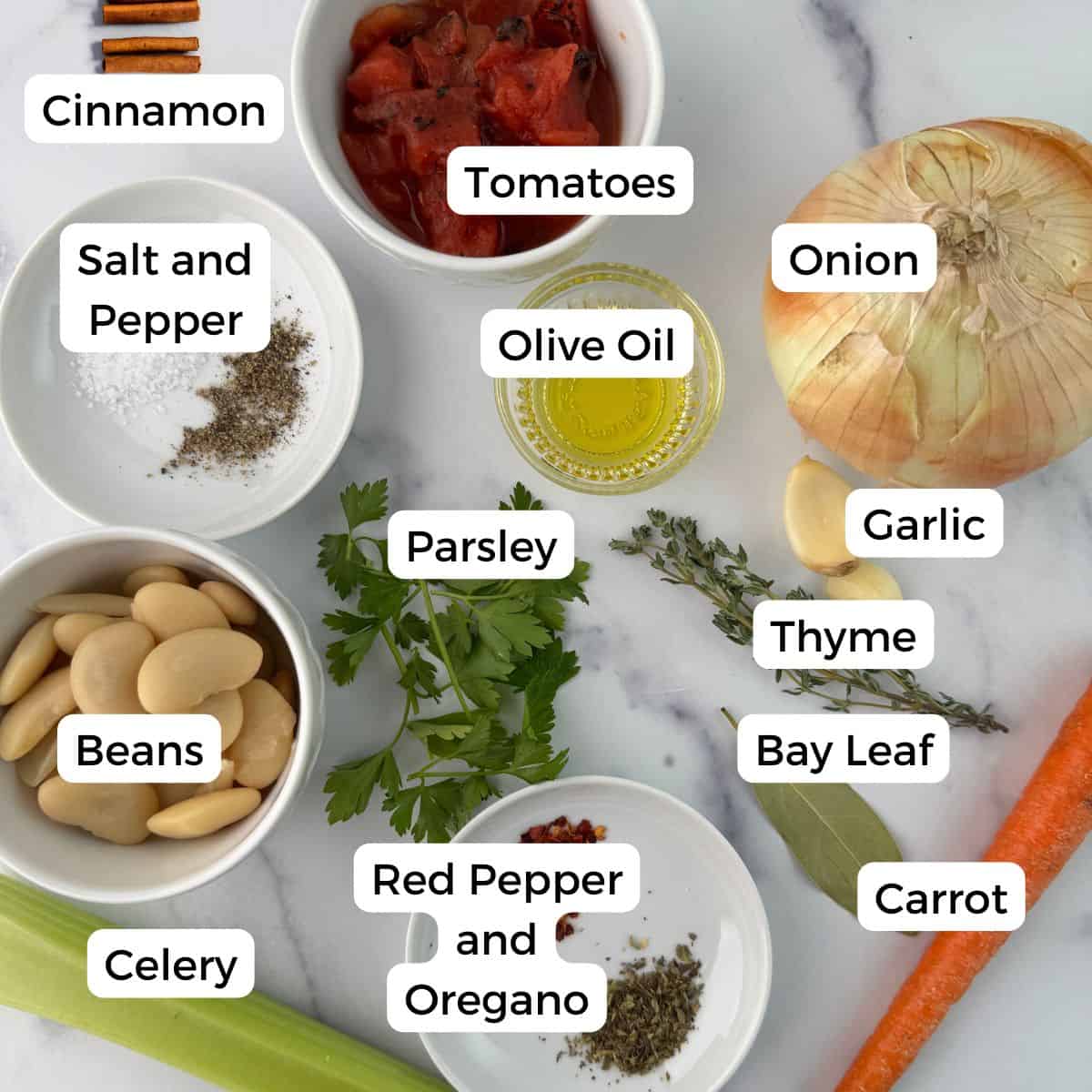 Ingredients include cinnamon, tomatoes, onion, olive oil, garlic, thyme, bay leaf, carrot, red pepper flakes, oregano, celery, beans, parsley, salt and pepper. 