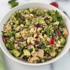 Mediterranean tuna salad in a white bowl.