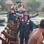 Coming home in the rain via a dugout canoe.