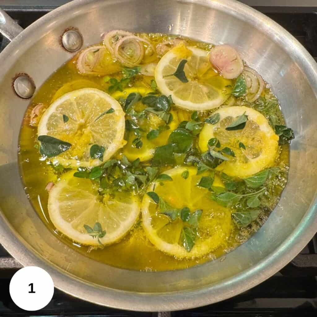 Heating the oil in a saute pan and adding the lemon, oregano, and shallots.