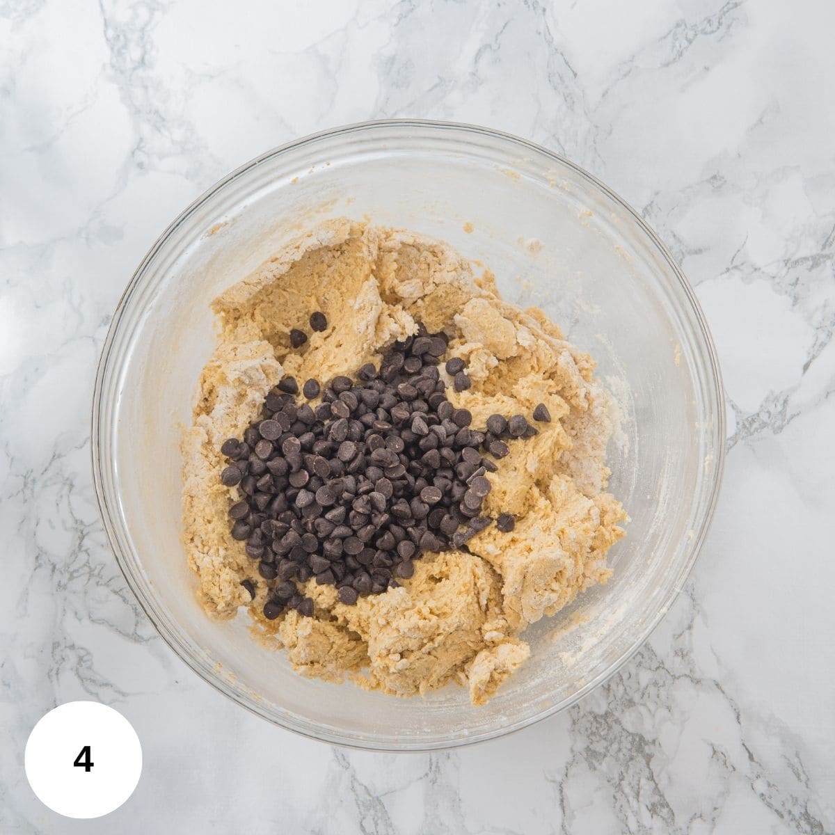 A bowl with the cookie dough in it.
