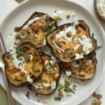 Mediterranean Eggplant on a white plate with a fork.