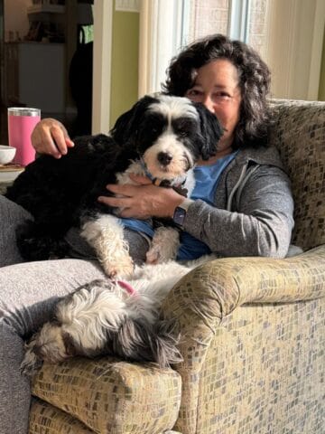 Sitting in a chair with Walt and Poppy.