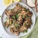 Grilled za'atar chicken with a lemon yogurt garlic sauce on the side.