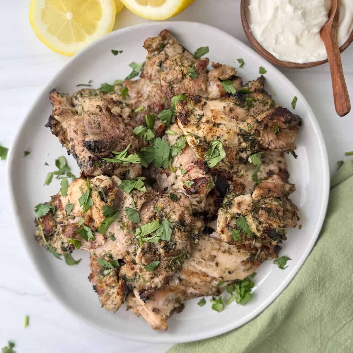 Grilled za'atar chicken with a lemon yogurt garlic sauce on the side.