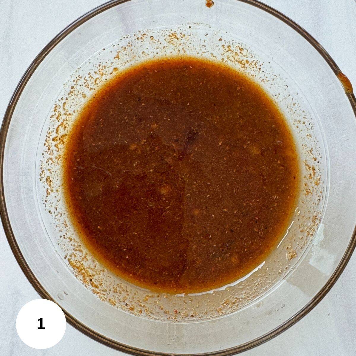 All of the salmon ingredients mixed together in a small bowl. 