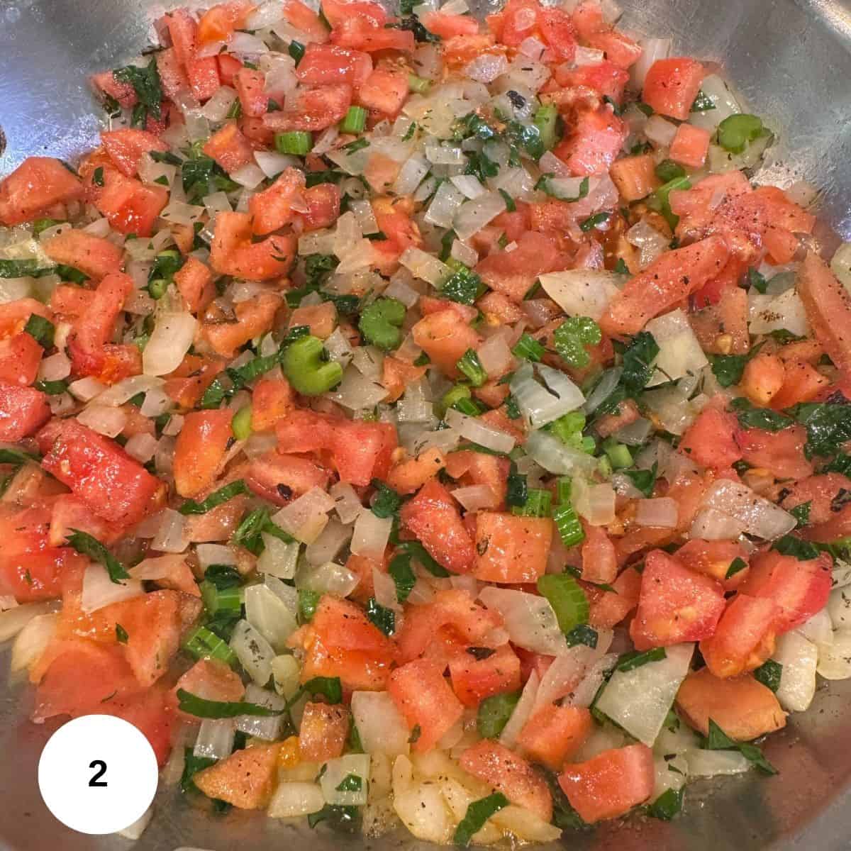 Cooking the tomatoes and other base ingredients in a pan on the stove. 