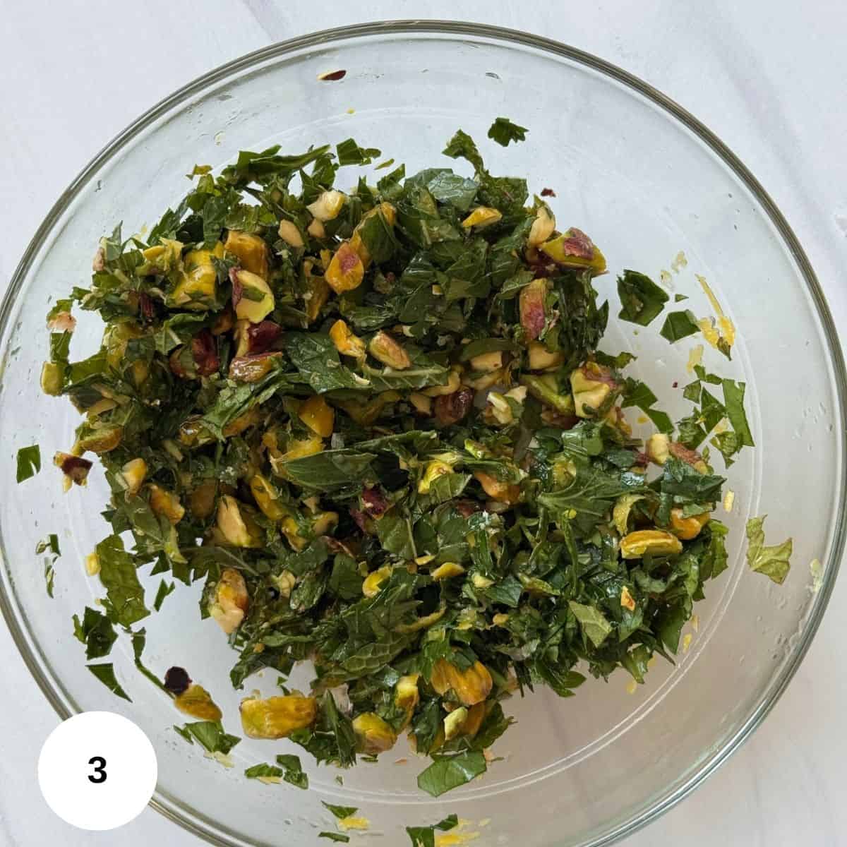 Preparing the gremolata topping in a small bowl. 