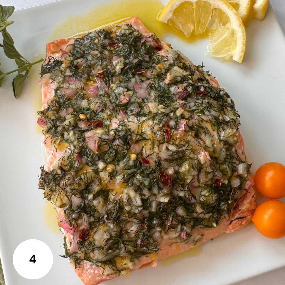 Topping the fish with the olive oil and lemon juice mixture. 