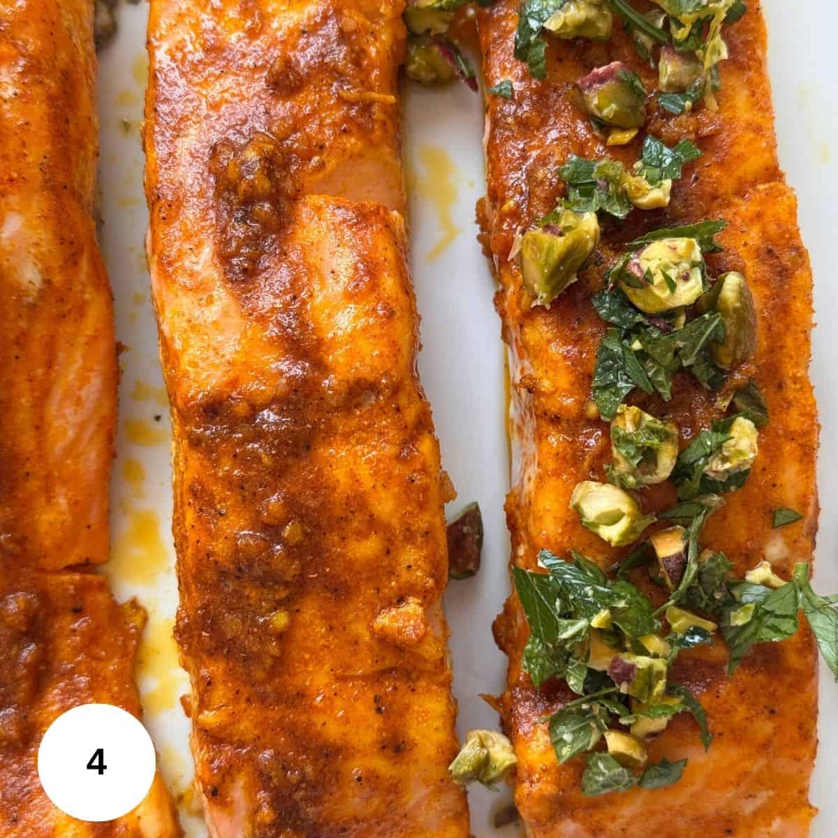 Topping the salmon with the pistachio-mint gremolata. 